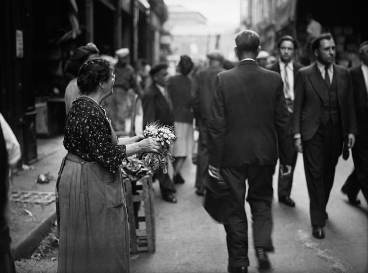 A woman sells her radish production, in August 1946 in the district of Les Halles in Paris, at the resumption of the activity in the Halles quarter