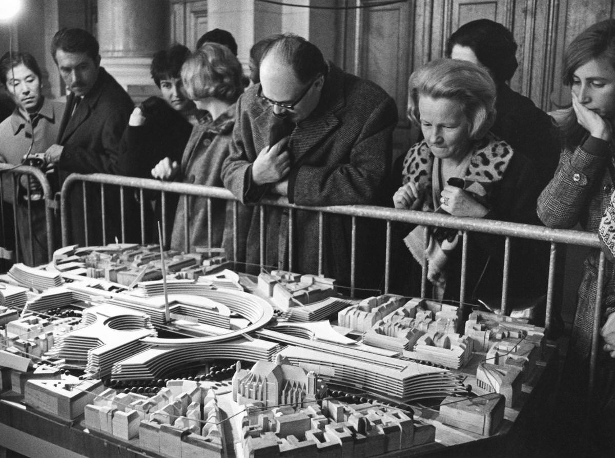 Parisians observing the model of an architectural project for the Les Halles shopping center in Paris, 1960