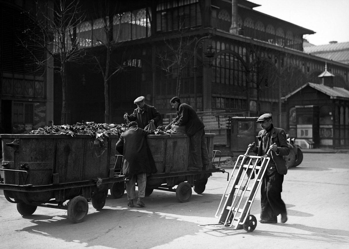 Poor people search a garbage can in March 1945, in the district of Les Halles in Paris, 1940s