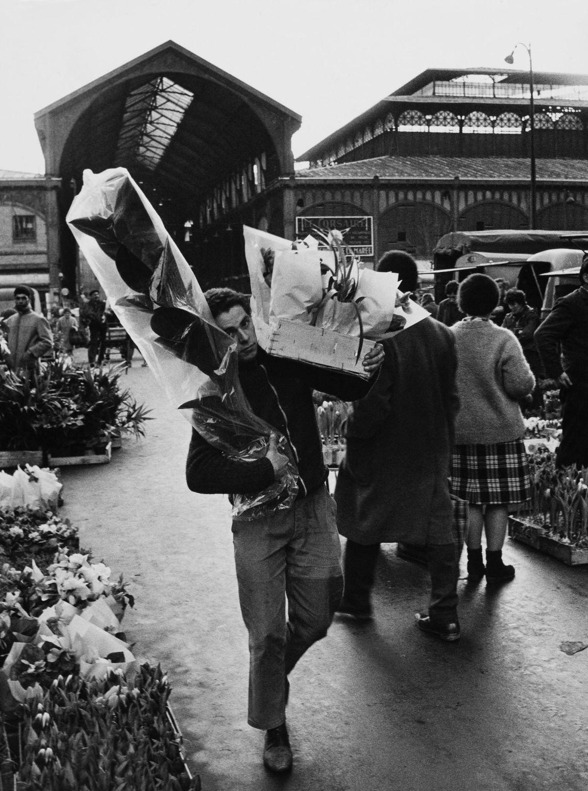 A Man Carrying some bouquets of Flowers, 1960s