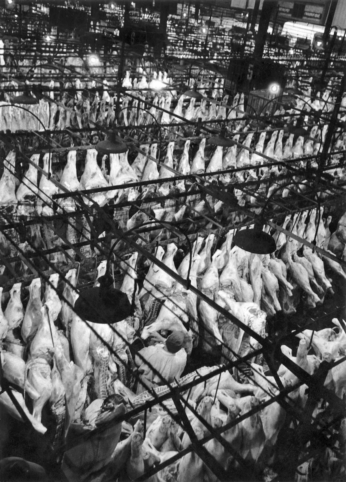 The meat hall in Les Halles, which was historically the traditional central market of Paris, at seven in the morning, on June 3, 1955