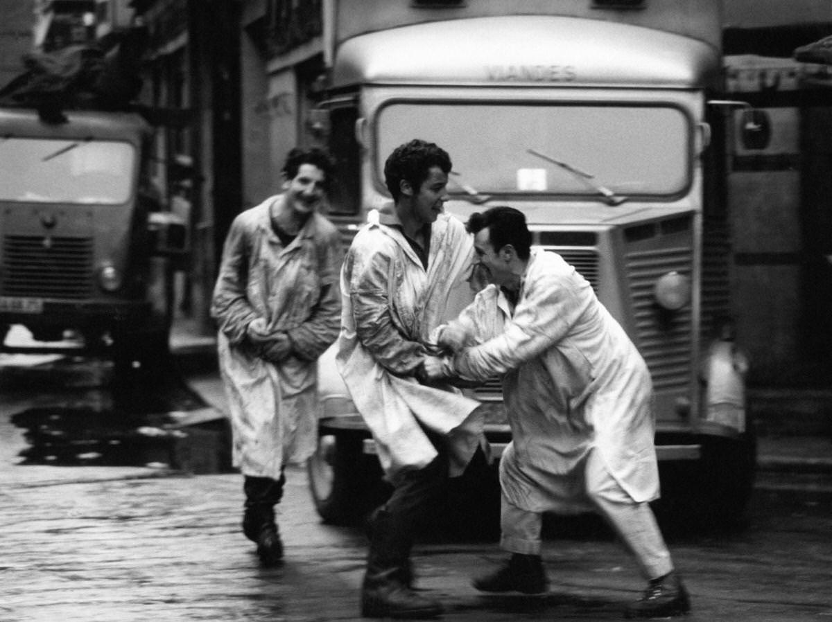 Market porters playing up in Les Halles, which was historically the traditional central market of Paris, those men were called 'Forts des Halles', 1967