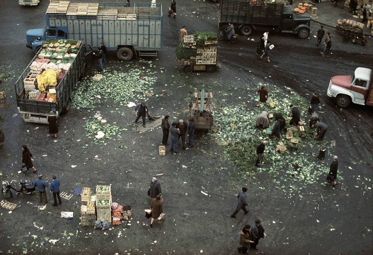 At the end of market in Les Halles some people are searching for some goods to salvage, Les Halles, 1967