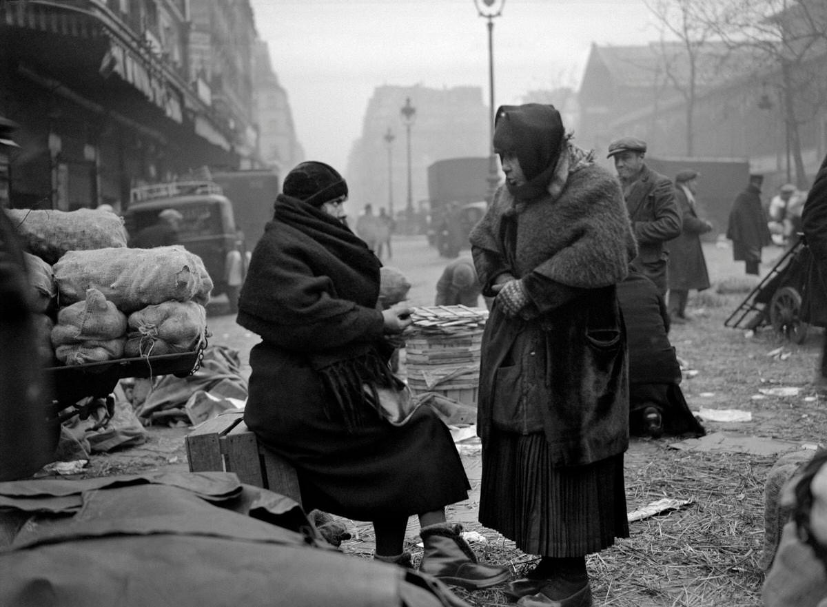 Women freezing during the season of winter, in the street of the Les Halles district, 1930s