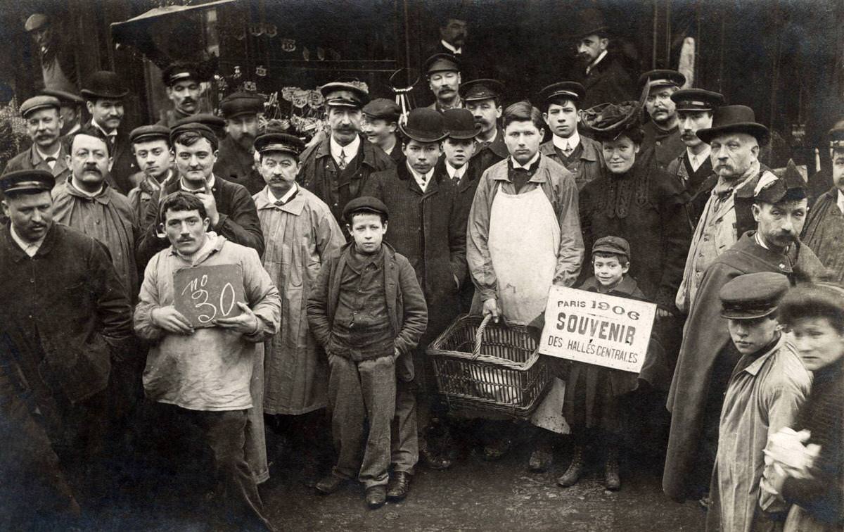 Employees and customers of Les Halles market stalls in Paris, 1906.