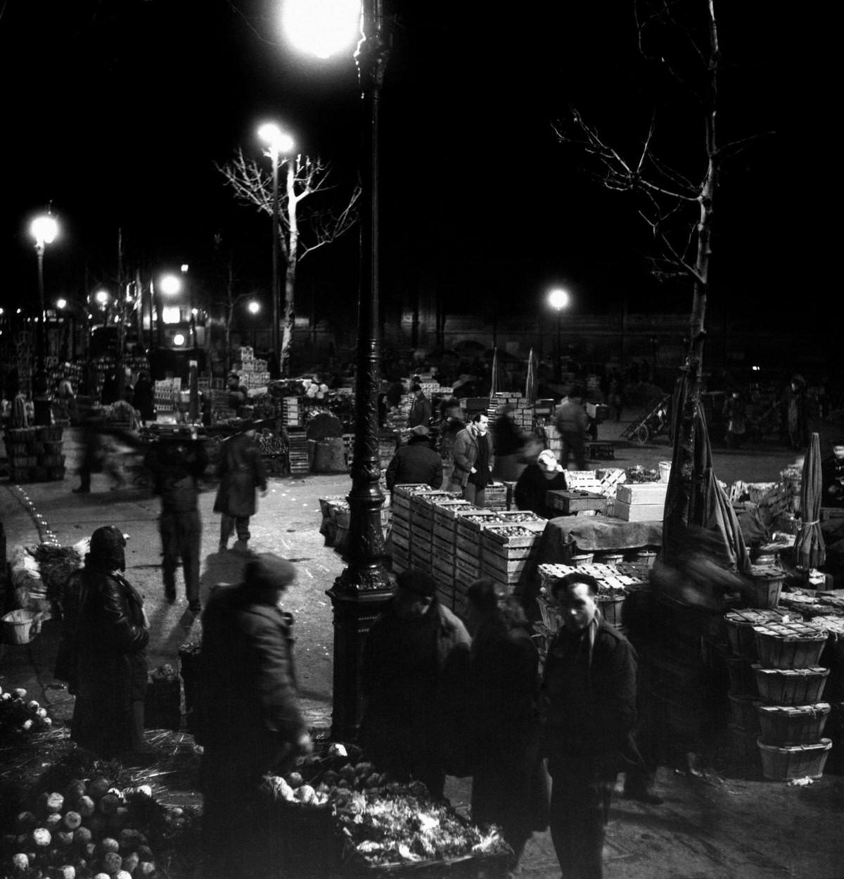 Early in the morning in Les Halles, the traditional central market of Paris, in 1953