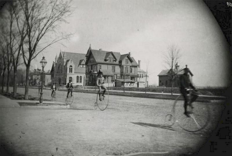 Five High Wheeler Bicycle Riders, 1890. Grand Avenue Congregational Church is in the background.
