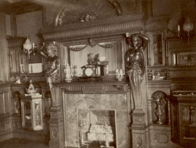 Fireplace.1893. An atlas, left, and caryatid flank the fireplace in the dining room of the George Brumder residence at the corner of Grand (later Wisconsin) Avenue and 18th Street.