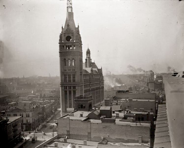 Elevated view from the top of a building of Milwaukee City Hall under construction, 1895