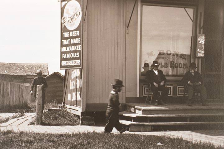 Small sailor walking down boardwalk, 1890