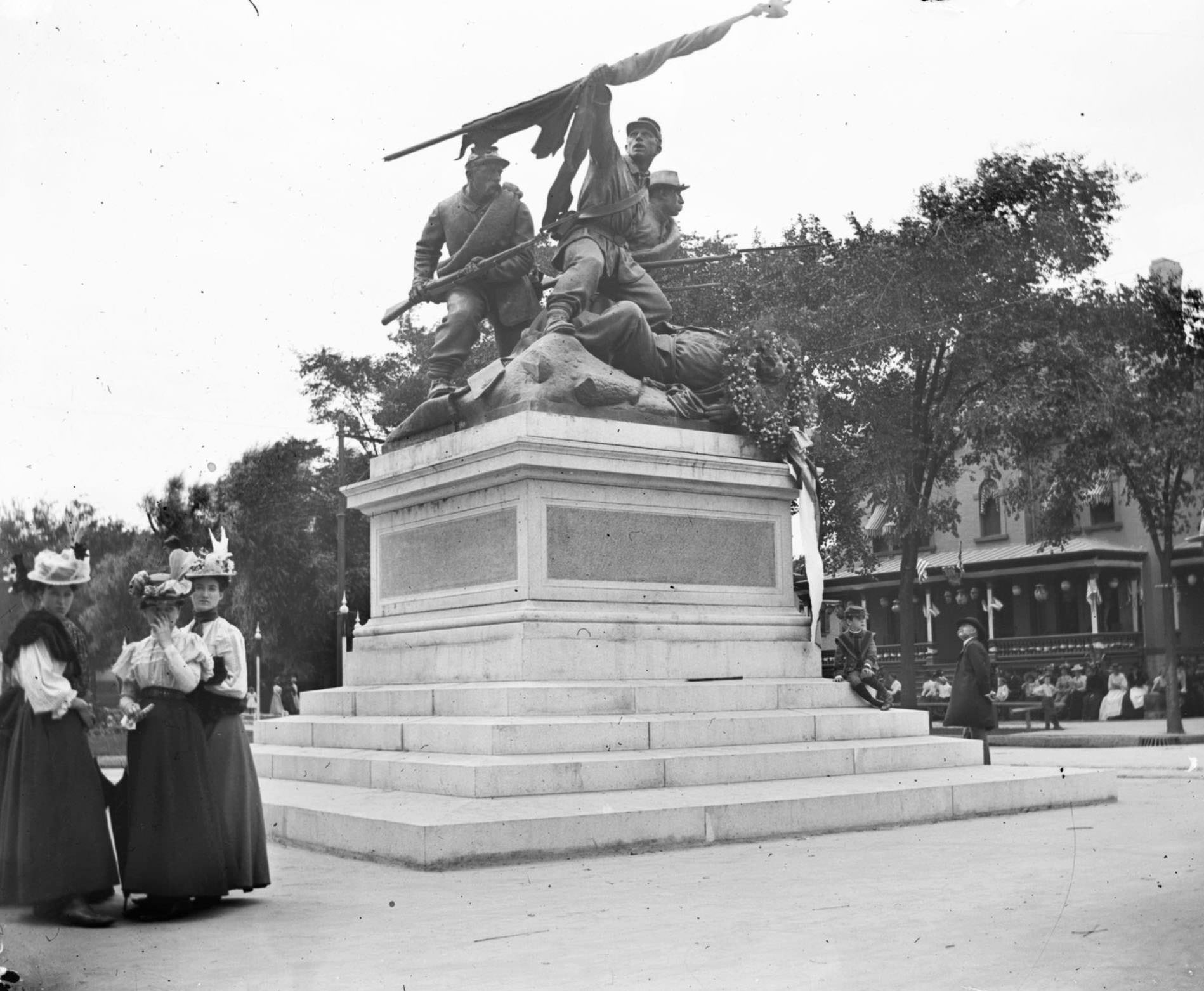 Women congregate near 'The Victorious Charge,' a monument to Soldiers who fought in the Civil War located in Milwaukee's Court of Honor on the median between the lanes of West Wisconsin Avenue, Milwaukee, Wisconsin, 1898.