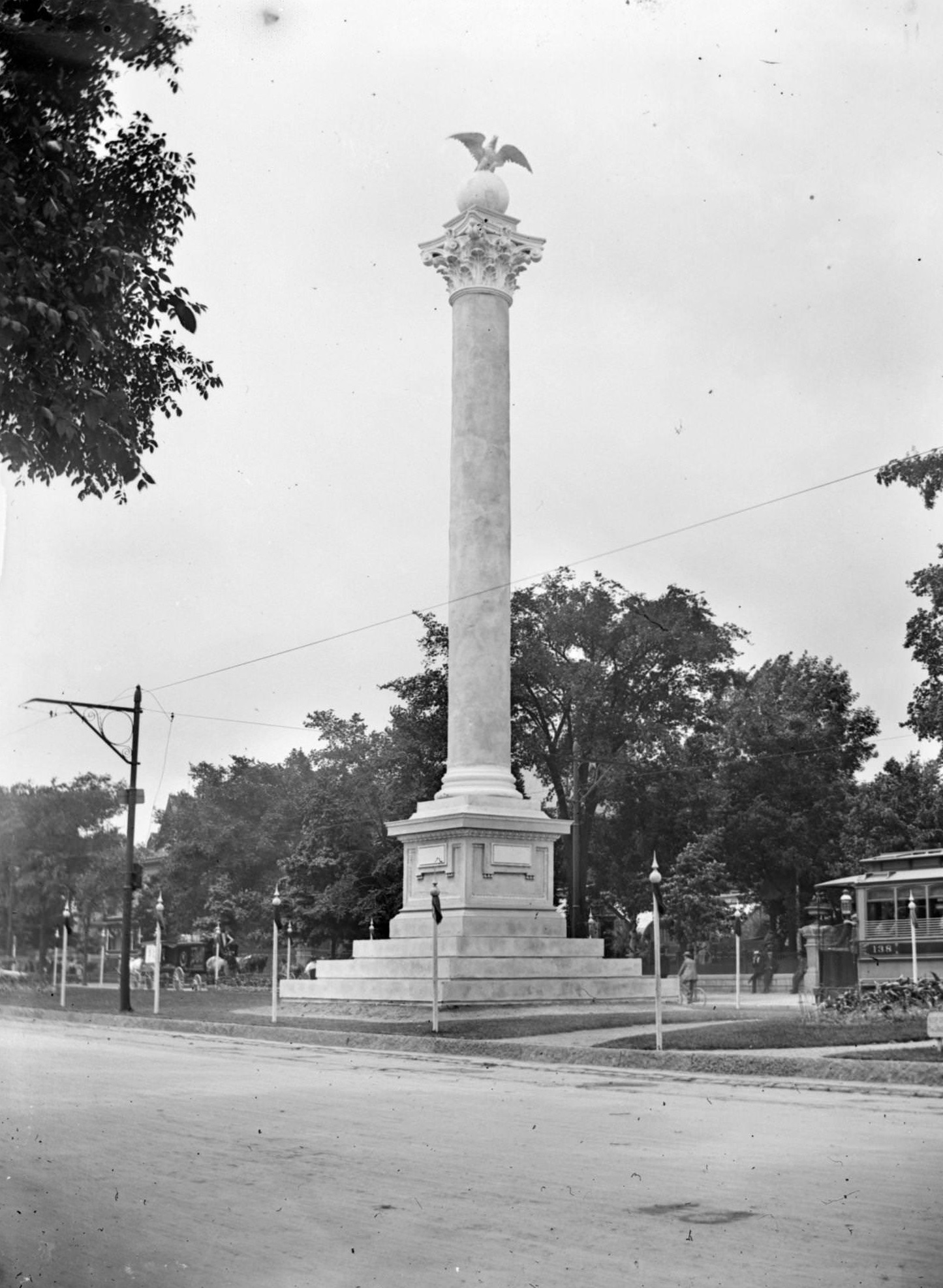 Across street of the Midsummer Festival Monument in the Court of Honor on the median of Grand Avenue, Milwaukee, Wisconsin, 1898.