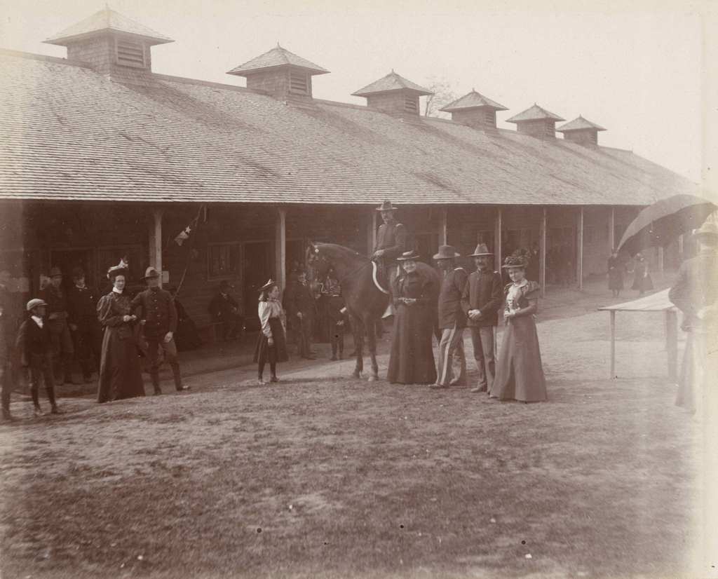 Women and children visit soldiers at Camp Harvey, Milwaukee, Wisconsin, 1898.