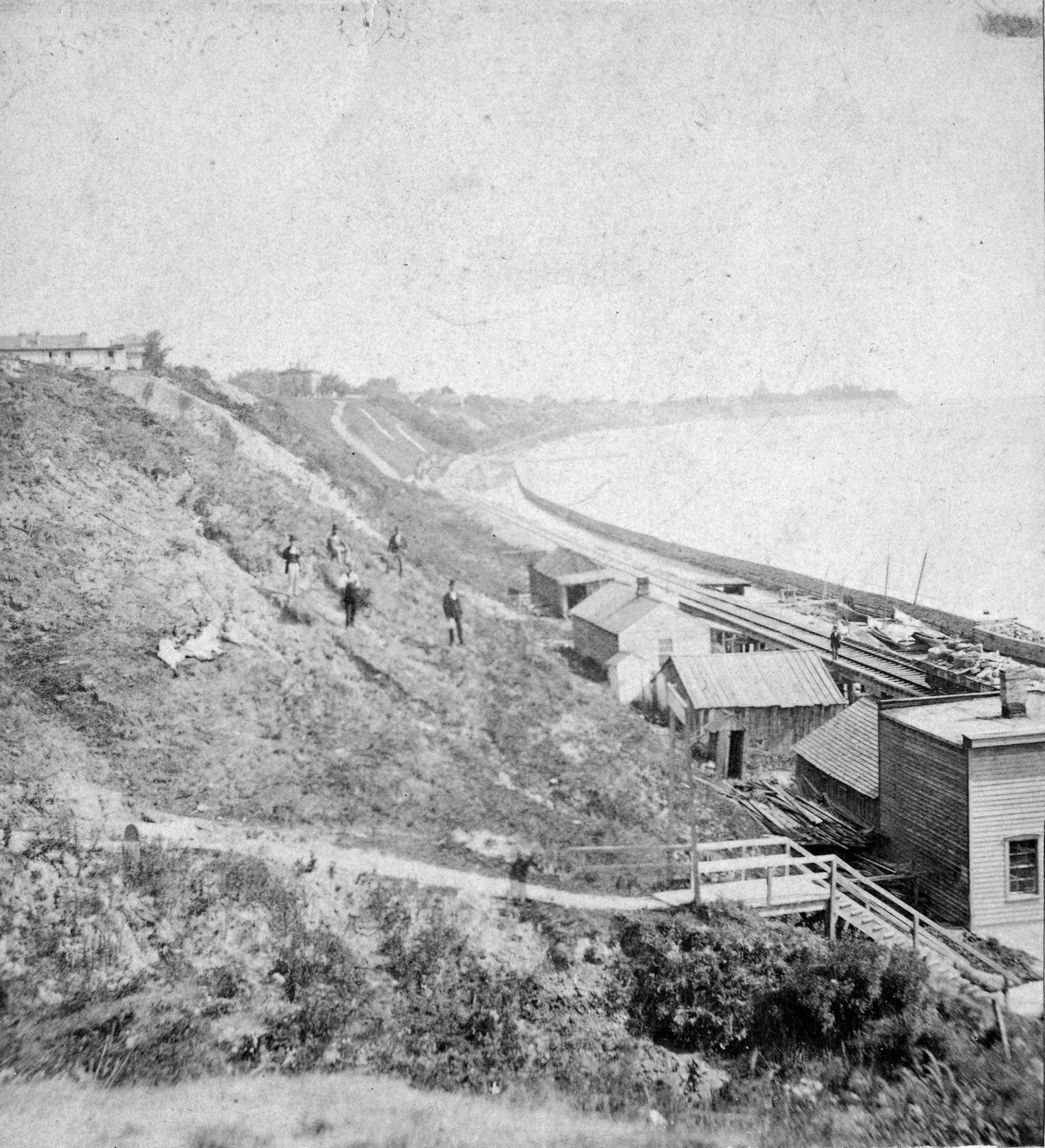 View of bluffs and buildings on the shore of Lake Michigan, Milwaukee, Wisconsin, 1877.