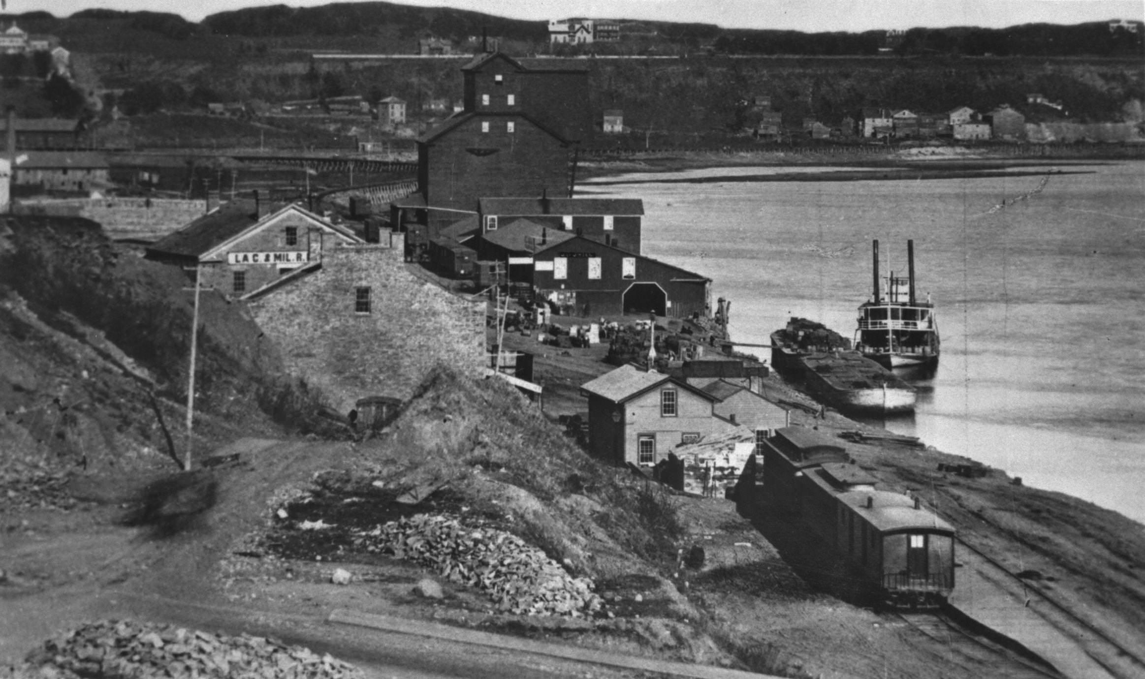 A levee scene with an unidentified boat at the La Crosse and Milwaukee rail road at St. Paul, 1867