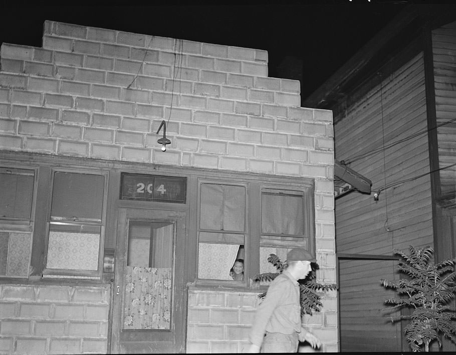 Man leaving prostitute's house, Peoria, Illinois, 1938