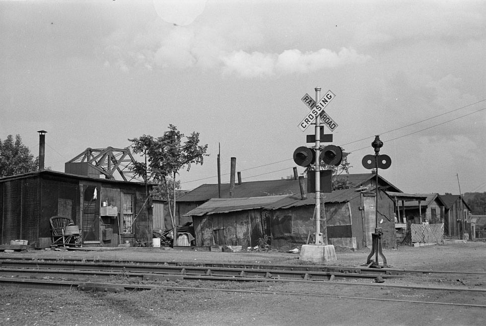 Slums at Cinder Point between railroad and Illinois River, Peoria, Illinois, 1938