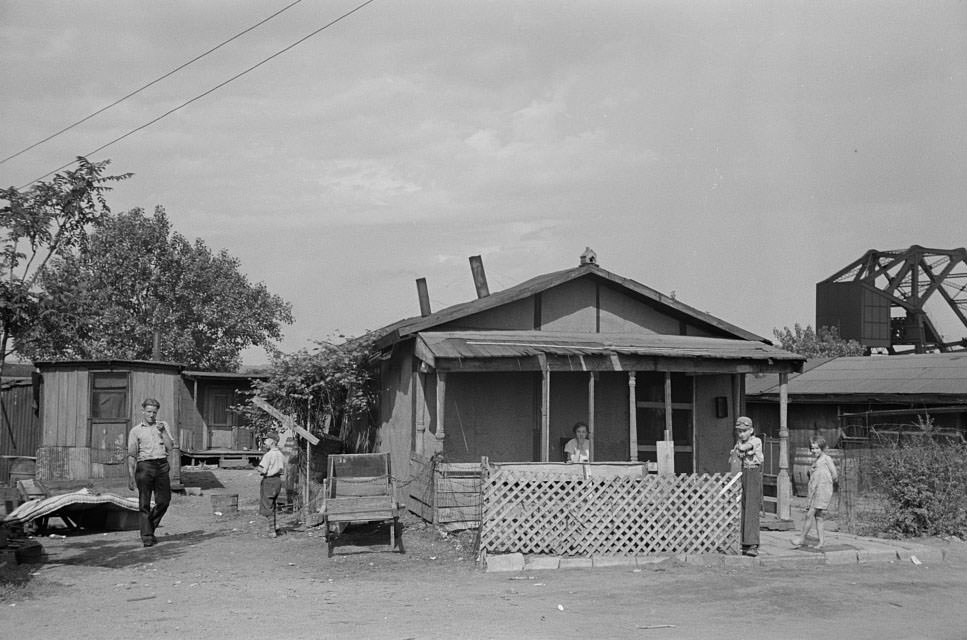 Slums at Cinder Point between railroad and Illinois River, Peoria, Illinois, 1938