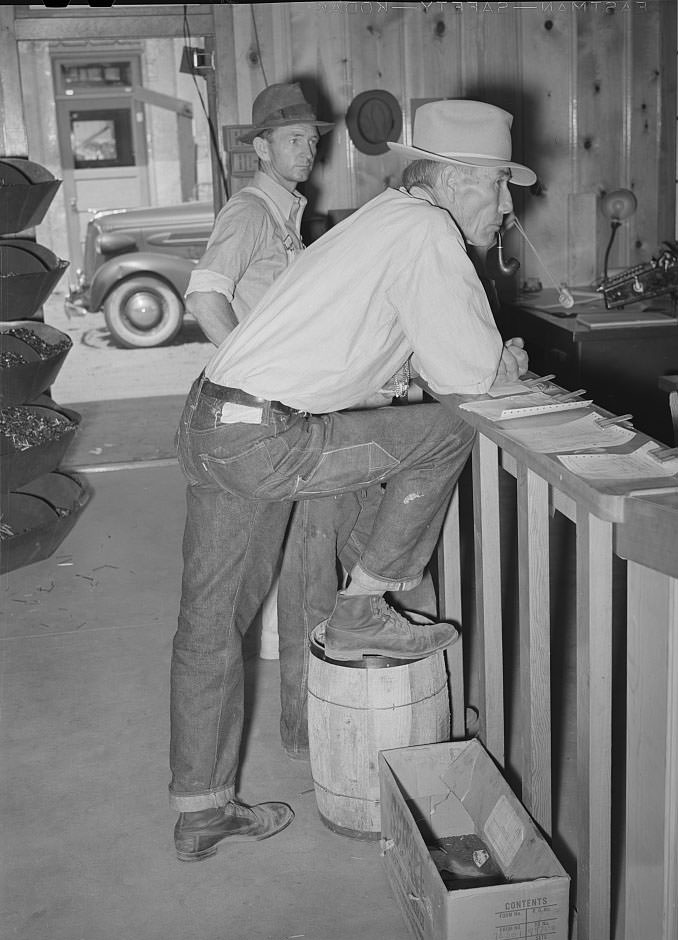 Farmers waiting at the lumber yard office of the United Producers and Consumers Cooperative, Phoenix, Arizona, 1940