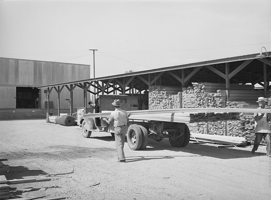 Untitled photo, possibly related to: Lumber being loaded onto truck at the Producers and Consumers Cooperative, Phoenix, Arizona, 1940