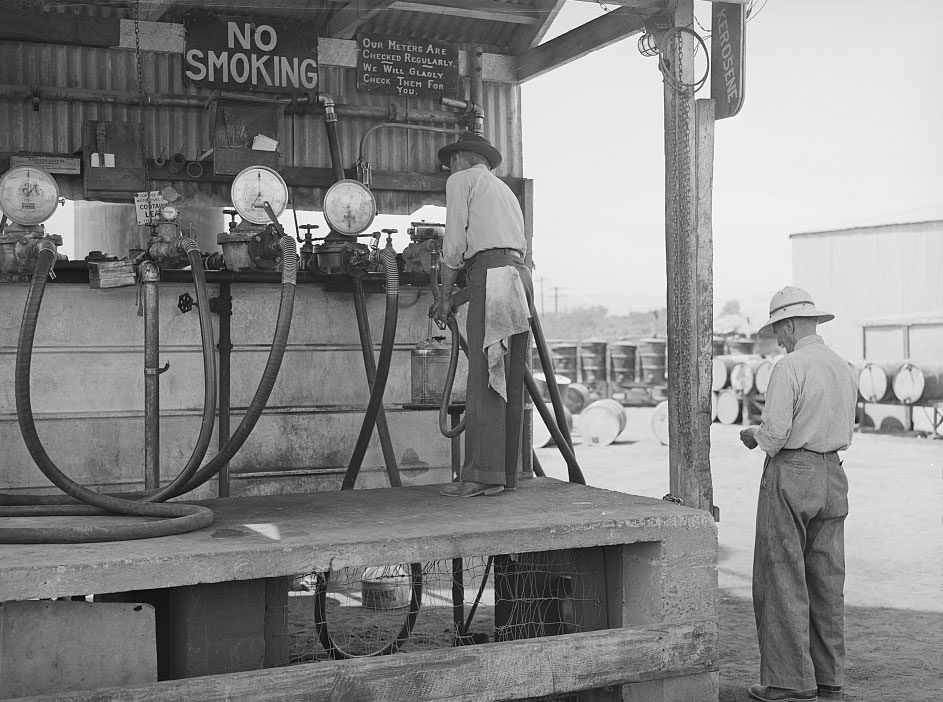 Untitled photo, possibly related to: Member of the United Producers and Consumers Cooperative having a drum filled with gasoline at the warehouse, Phoenix, Arizona, 1940