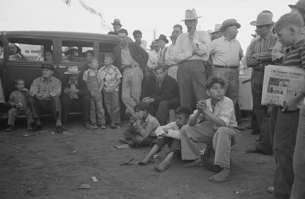 Audience listening to orchestra playing outside grocery store on Saturday afternoon, Phoenix, Arizona, 1940