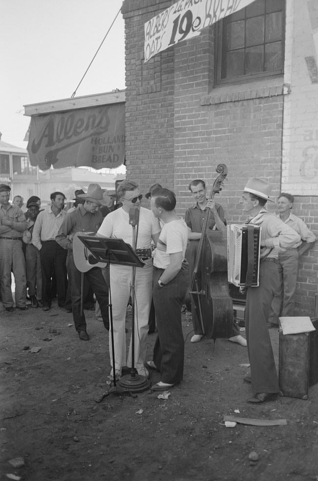 Orchestra playing outside a grocery store on Saturday afternoon which is designed to attract customers to the store, Phoenix, Arizona, 1940