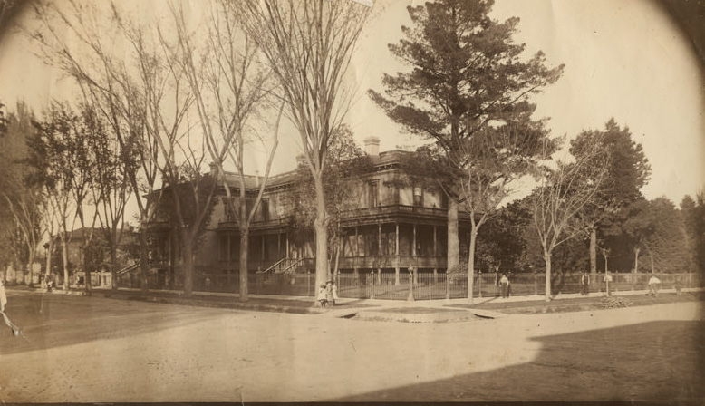 The Margaurite [sic] Shows two-story residential building surrounded by wrought iron fence on corner of Seventh and Q Streets, Sacramento, 1884