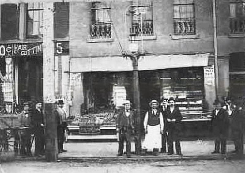 The storefront of two businesses, 1885