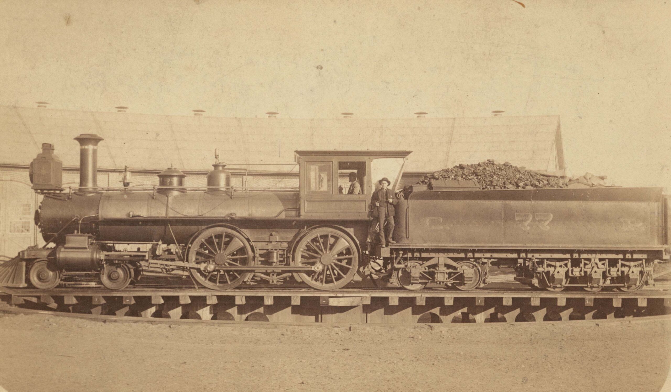 Central Pacific Railroad steam locomotive No. 77 and crew, 1888