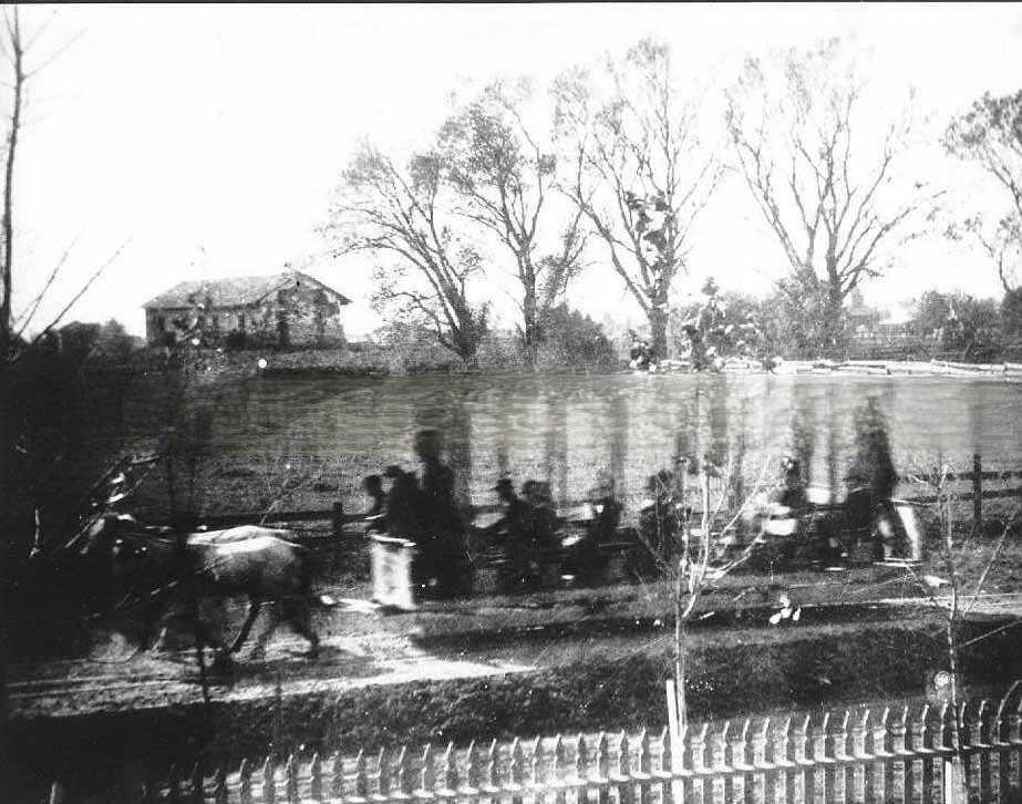 A horse drawn street car passing the Sutter's Fort derelict building, 1881