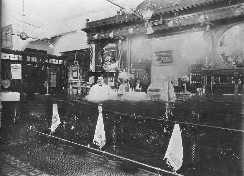 Interiior view of bar of The Old Corner saloon, 1887