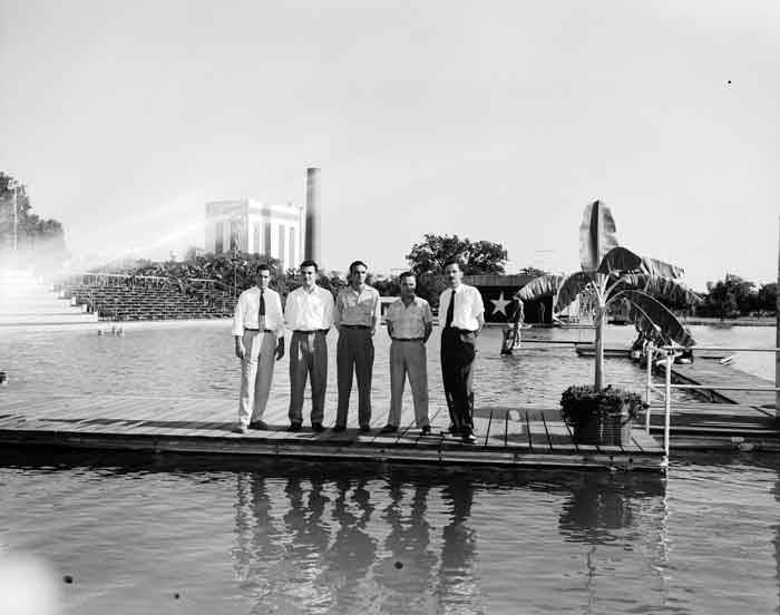 Men on boardwalk on lake at Lone Star Brewing Company, 542 Simpson Street, 1955