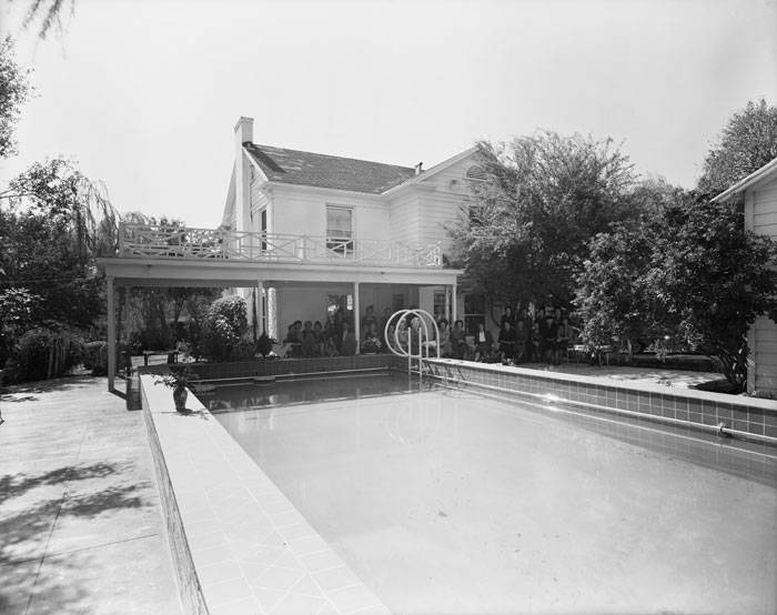 Women's group near swimming pool behind Evan and Gladys Moon residence, 223 Parklane Drive, Olmos Park, 1950s