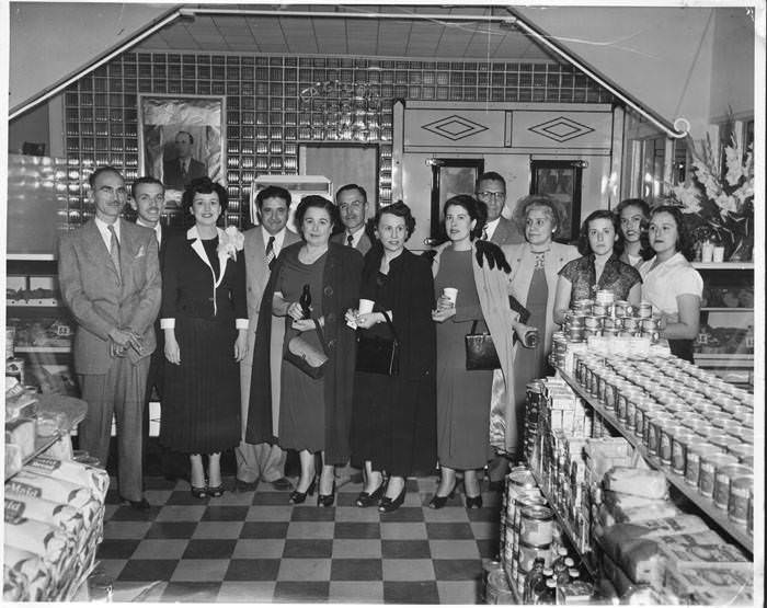 Oscar and Rosalinda Elizondo and guests in La Gloria Food Market, 701 S. Laredo Street, San Antonio, 1950