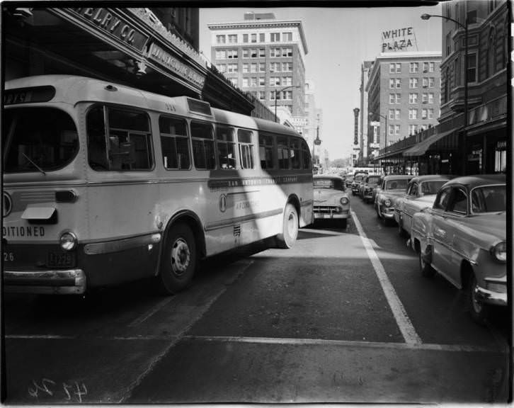 Photograph shows a bus in downtown San Antonio Traffic, 1953