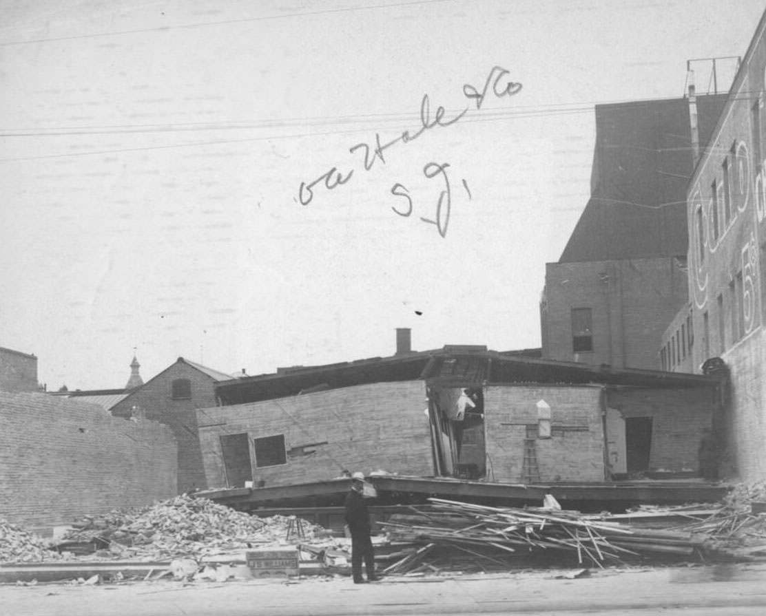 Man examining the ruins of the OA Hale & Co. building, caused by 1906 earthquake in San Jose.