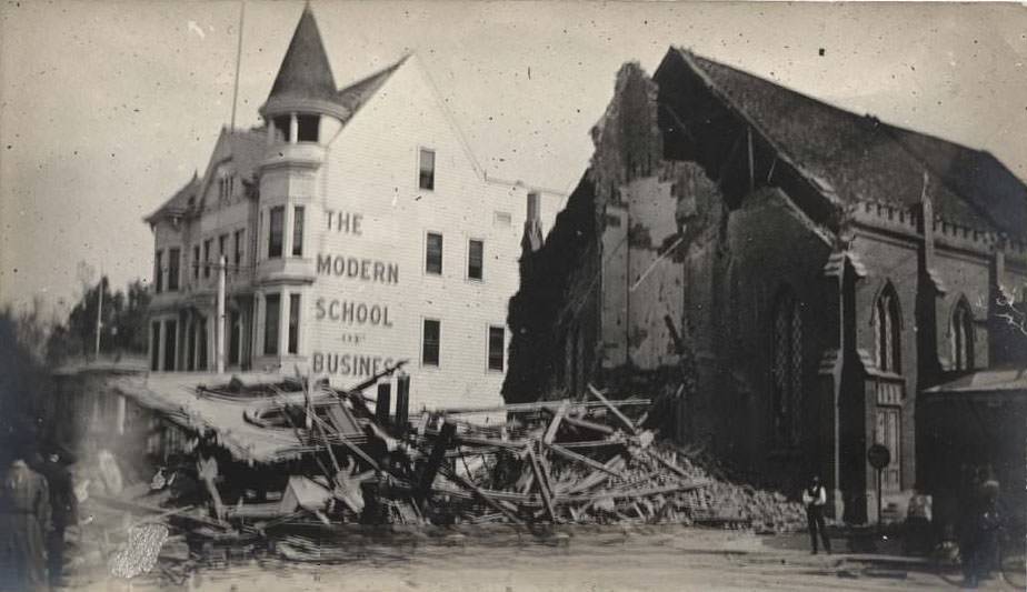 Earthquake damage to Presbyterian Church, North Third Street, San Jose. CA. Modern School of Business is in background, 1906