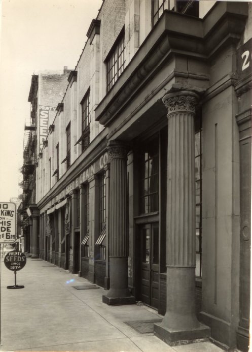 Two sets of stone pillars flank the entrances to this squat and substantial building at 14-16 South First street, 1935