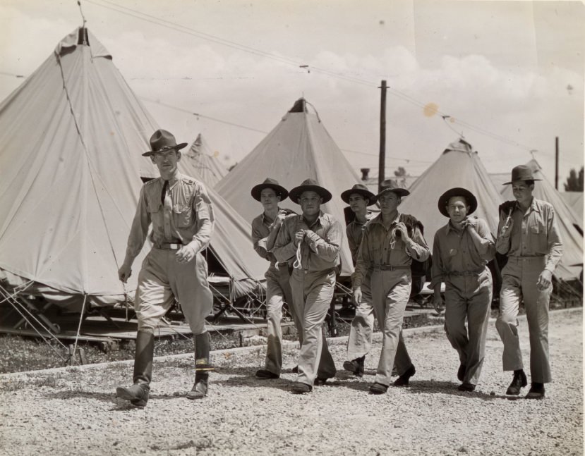 These men had finished their registration and were checking over their newly issued equipment as they rested in the tent assigned them, 1939