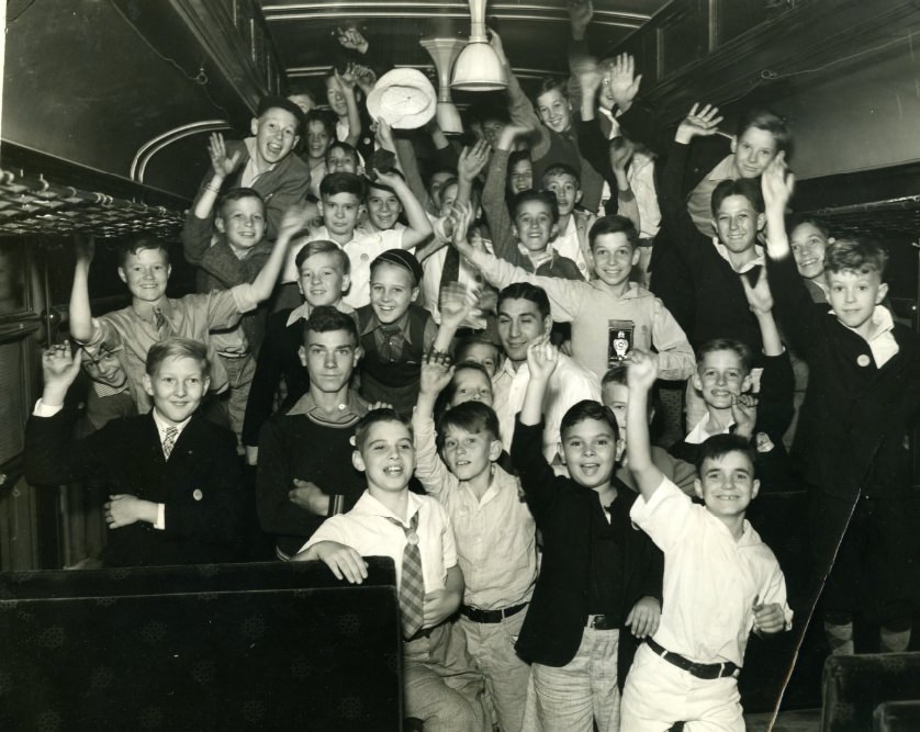 Some of the members of the Globe-Democrat 1935 Boys' Outing Club, who took time inspect the engine as their special train stopped in Jefferson City yesterday en route to Bagnell Dam on a two-day outing, 1935