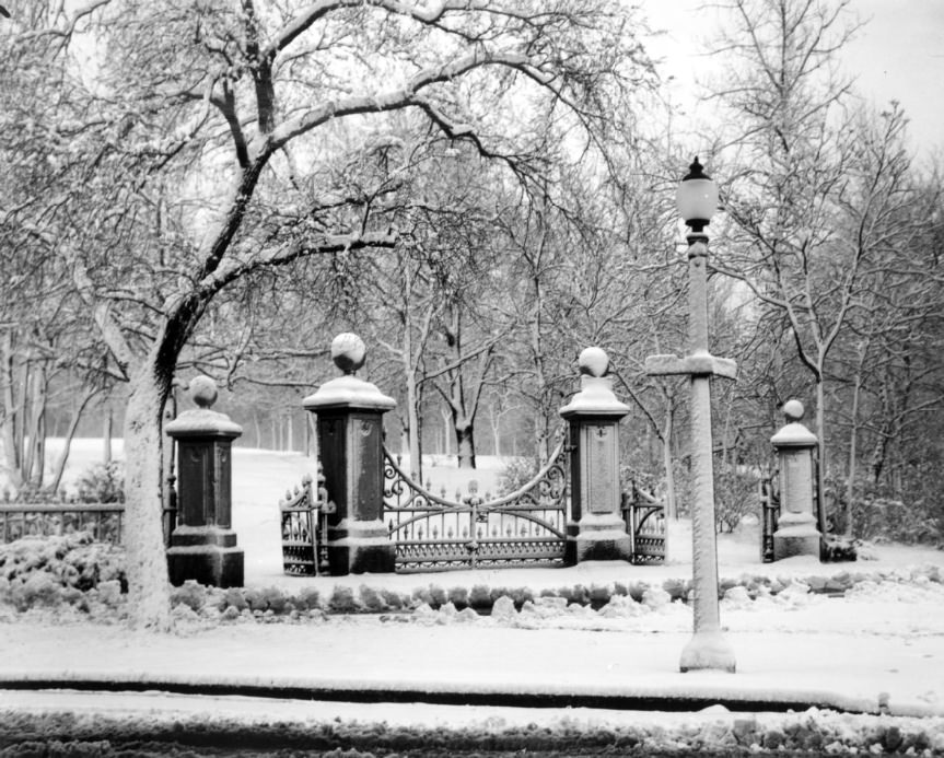 The snow-covered entrance gates to Lafayette Park in the winter, 1934