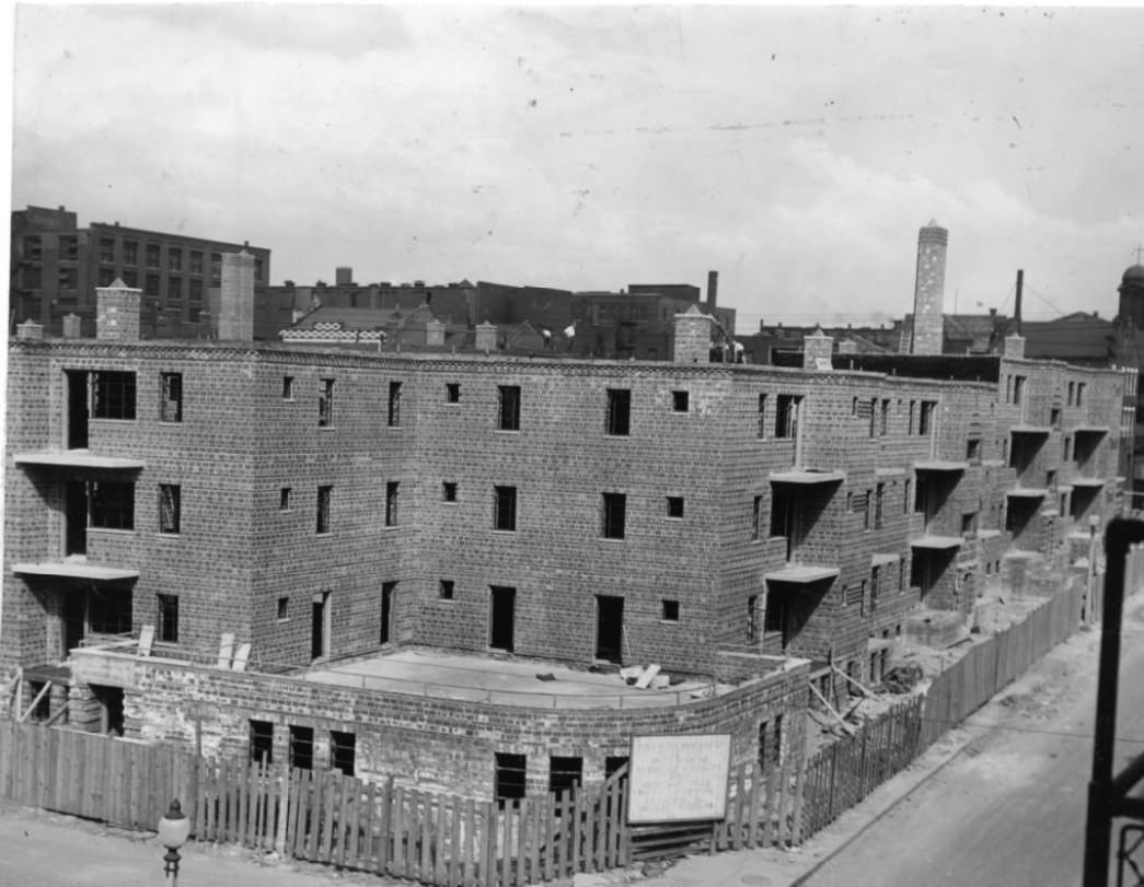 The 252-family Neighborhood Gardens development is nearing completion in the block between Sevent, Eighth, Biddle, and O'Fallon streets, 1930