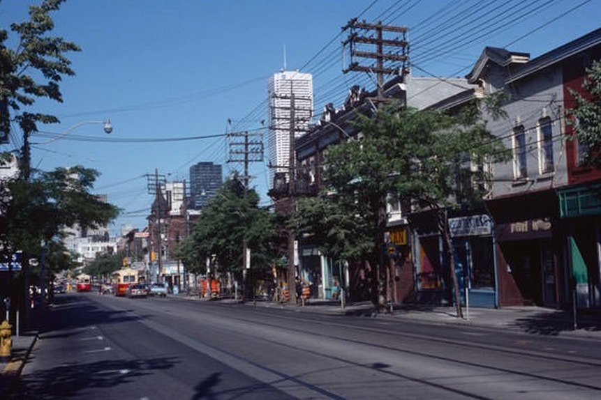 Queen and Bathurst, looking east, July 13, 1983.