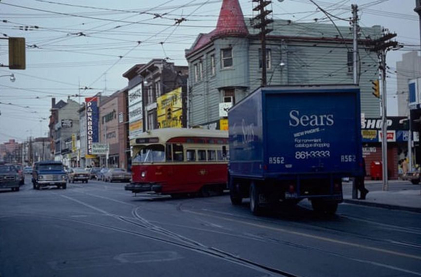 Streetcar turning south onto Church past a Sears delivery van, February 13, 1980.