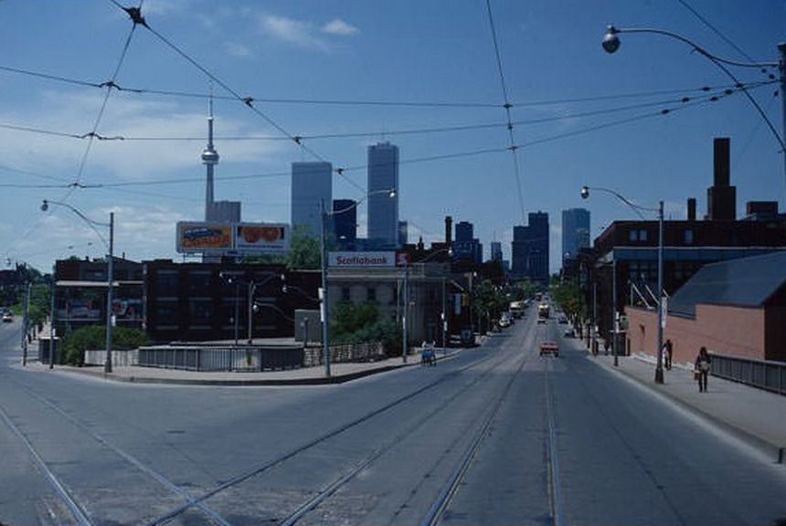 Intersection of Queen and King at the Don River, looking west. No Scotia Plaza, yet. Exchange Tower is under construction behind First Canadian Place. June 2, 1981.