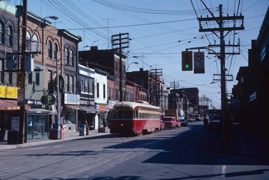 Queen and Broadview, looking east at the stores on the north side of Queen, April 2, 1982.