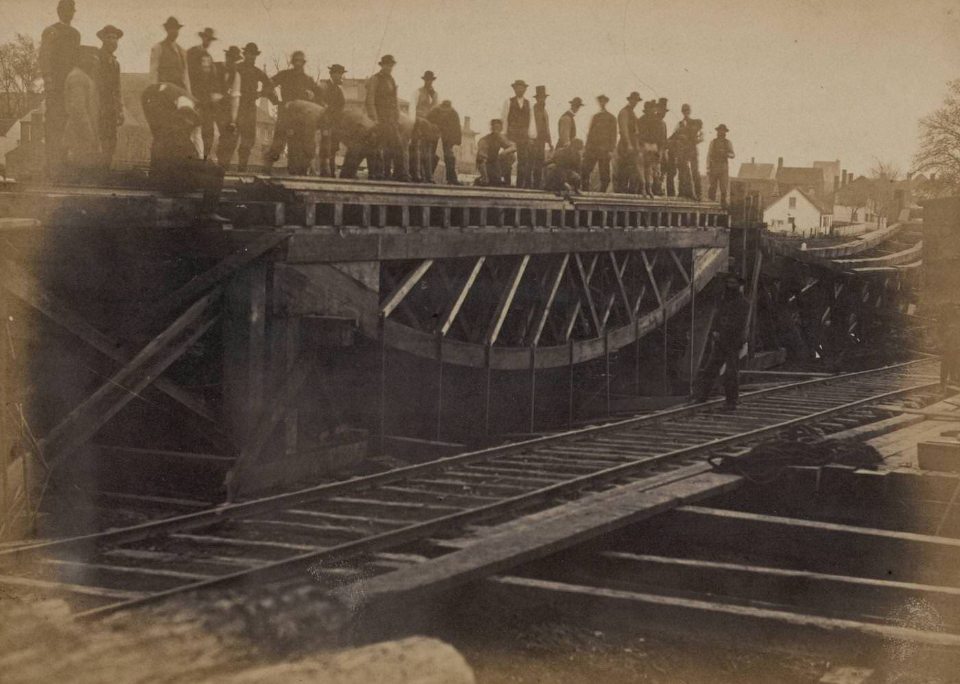 A construction corps loads a bridge to test its strength, in the third of a series of experiments with board trusses, Virginia, 1863.