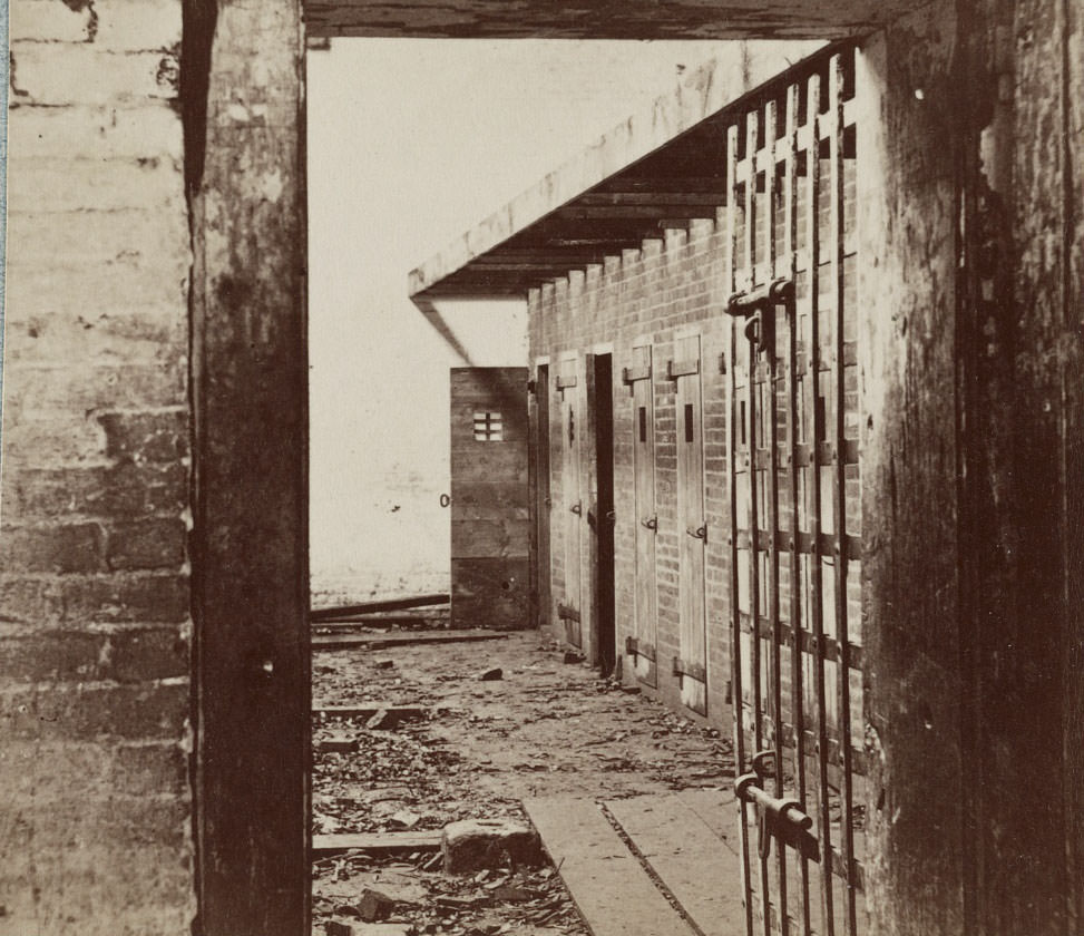 Interior view of a slave pen, showing the doors of cells where the slaves were held before being sold. Building address: 1315 Duke Street, Alexandria, 1862