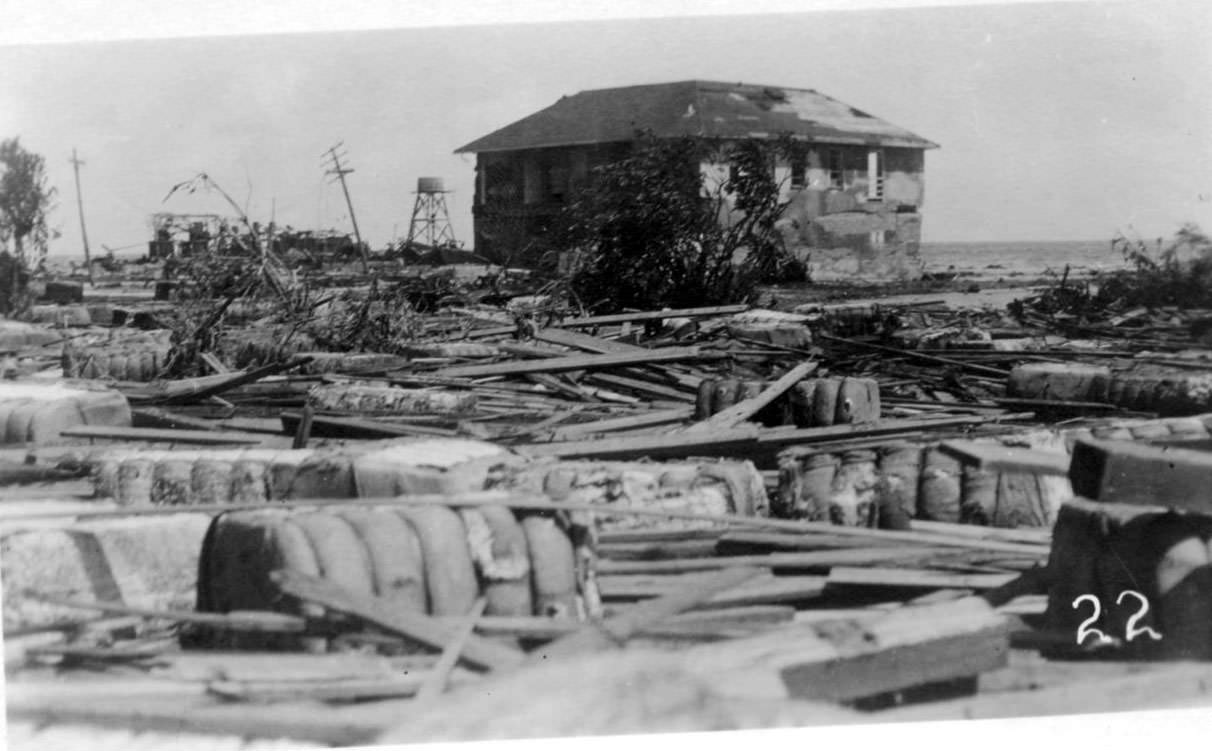 A two-story house surrounded by debris from the Corpus Christi hurricane of 1919.